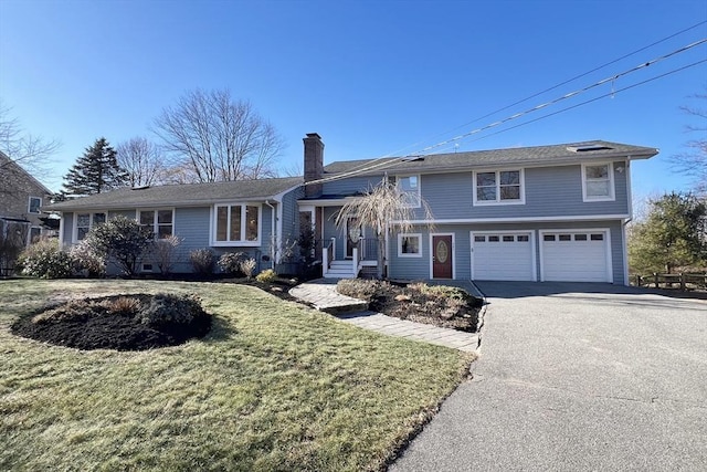 view of front facade with a front lawn and a garage