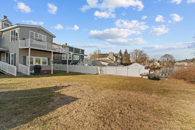 view of yard featuring a balcony