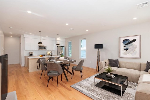 dining room featuring light wood-type flooring