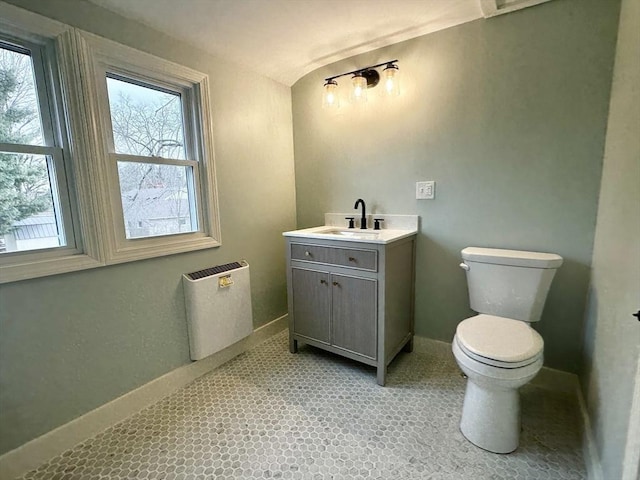 bathroom with tile patterned floors, vanity, and toilet