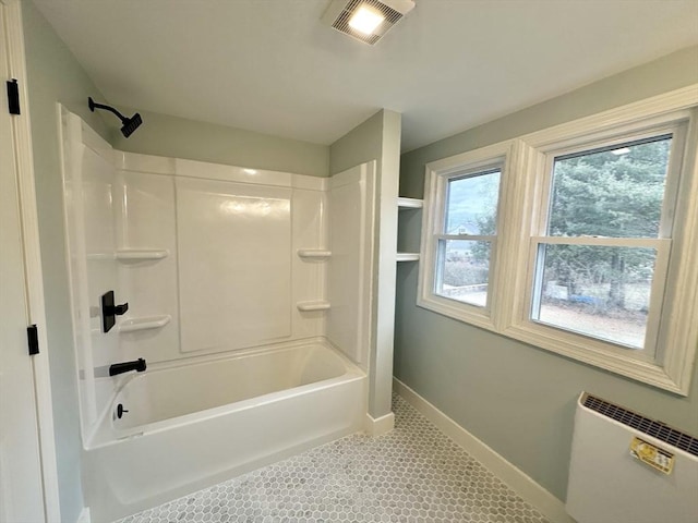 bathroom featuring tile patterned flooring and shower / bath combination