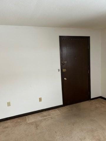 empty room with baseboards