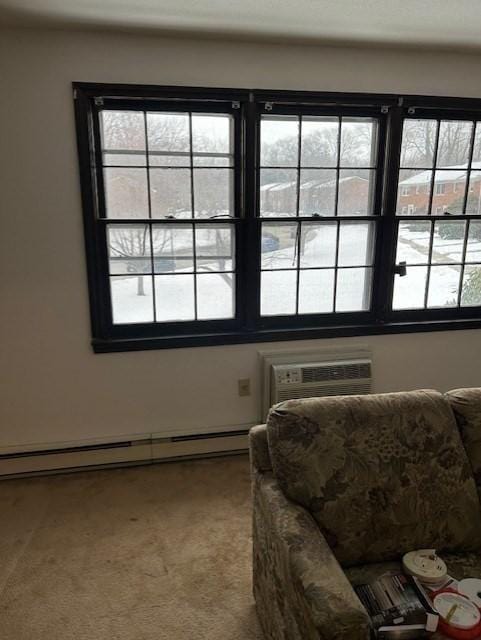 interior space featuring a wall unit AC and a baseboard heating unit