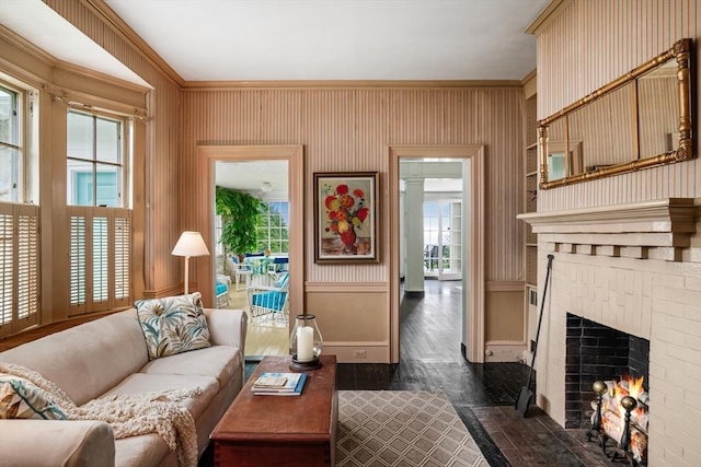 15 Brier Rd, Gloucester, MA 01930 - living room featuring crown molding, a brick fireplace, and dark wood-style flooring