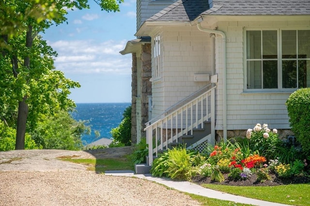 15 Brier Rd, Gloucester, MA 01930 - view of side of home featuring a shingled roof and a water view