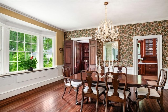 15 Brier Rd, Gloucester, MA 01930 - dining area with a chandelier, wainscoting, wallpapered walls, dark wood-type flooring, and ornamental molding