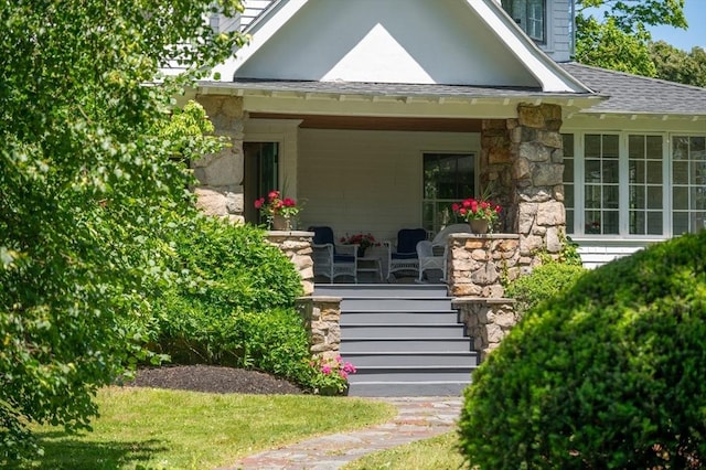 15 Brier Rd, Gloucester, MA 01930 - entrance to property featuring covered porch, stone siding, and roof with shingles