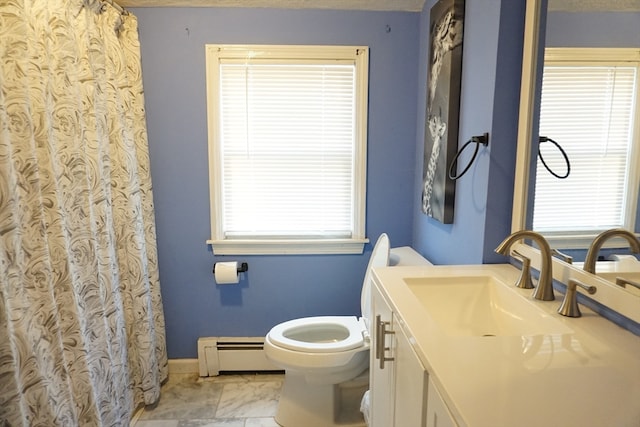 bathroom featuring a baseboard radiator, vanity, and plenty of natural light