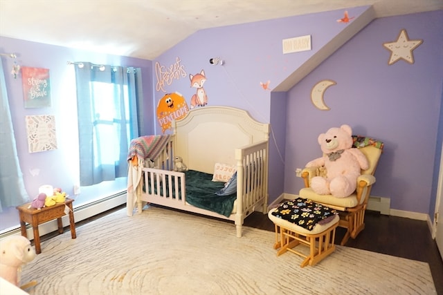 bedroom featuring hardwood / wood-style flooring, a baseboard heating unit, and lofted ceiling