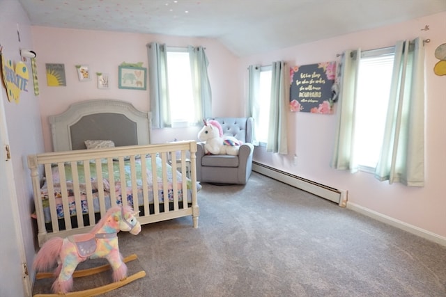 carpeted bedroom with lofted ceiling, a crib, and a baseboard radiator