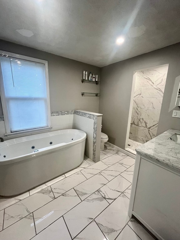 full bathroom with separate shower and tub, vanity, a textured ceiling, and toilet