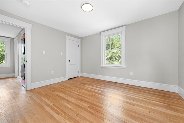 spare room with light wood-type flooring