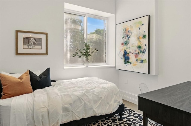 147 Sherman St Unit 201, Cambridge, MA 02140 - bedroom featuring baseboards and wood finished floors