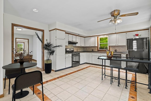 32 Dale St, Franklin, MA 02038 - kitchen featuring black appliances, decorative backsplash, ceiling fan, plenty of natural light, and recessed lighting