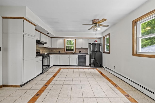 32 Dale St, Franklin, MA 02038 - kitchen featuring black gas stove, baseboard heating, freestanding refrigerator, dishwashing machine, and under cabinet range hood