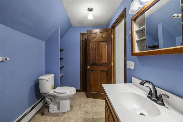 32 Dale St, Franklin, MA 02038 - bathroom with baseboard heating, vanity, and lofted ceiling