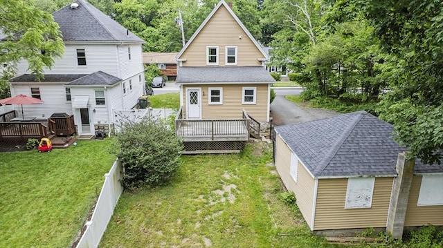 32 Dale St, Franklin, MA 02038 - back of house with a deck, a fenced backyard, and roof with shingles