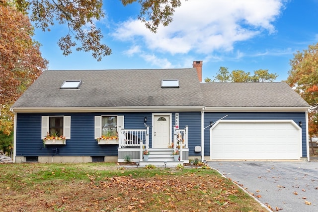 view of front facade with a garage and a porch