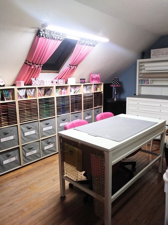 rec room with hardwood / wood-style floors and lofted ceiling