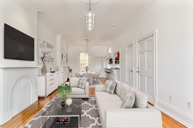 6 Brigham St Unit 1, Boston, MA 02128 - living area with crown molding and light wood-style flooring