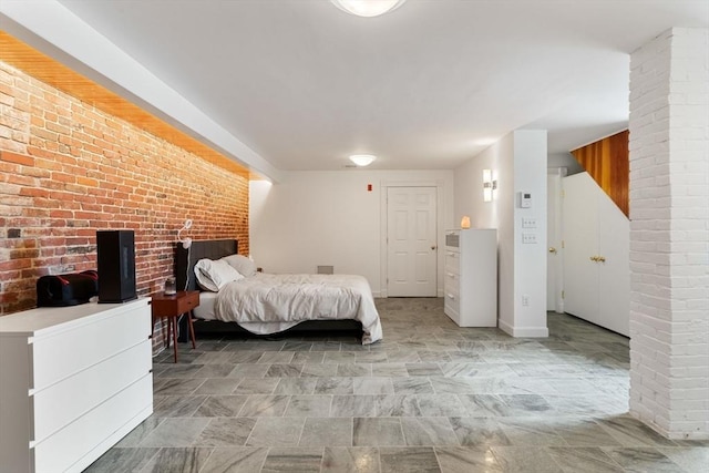 6 Brigham St Unit 1, Boston, MA 02128 - bedroom featuring brick wall and baseboards