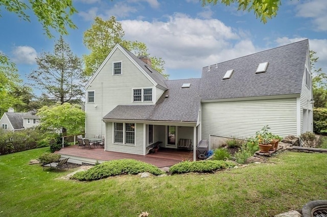 14 Parsons Hill Rd, Wenham, MA 01984 - rear view of property featuring roof with shingles, a deck, and a lawn