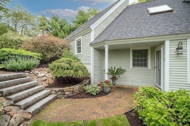 14 Parsons Hill Rd, Wenham, MA 01984 - view of home's exterior featuring roof with shingles and a patio area