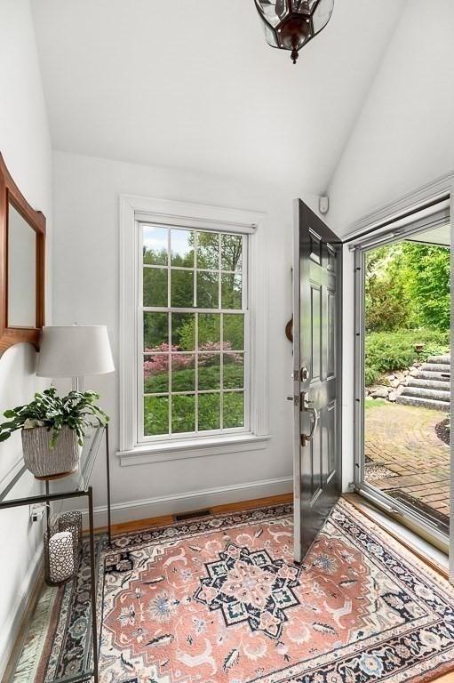 14 Parsons Hill Rd, Wenham, MA 01984 - entryway with lofted ceiling, baseboards, and wood finished floors