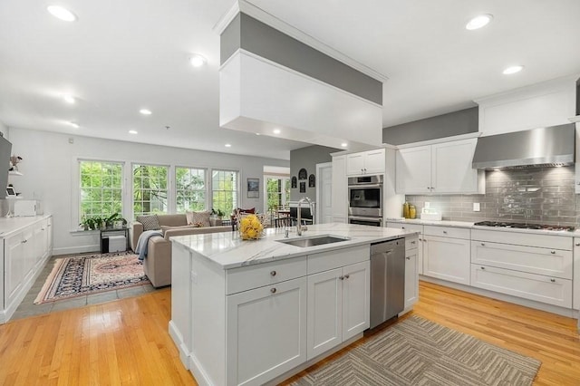 14 Parsons Hill Rd, Wenham, MA 01984 - kitchen featuring a sink, stainless steel appliances, light wood-style floors, wall chimney range hood, and white cabinets