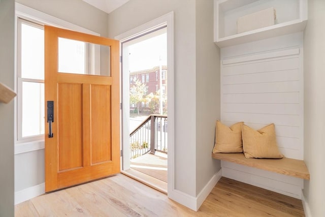 foyer entrance with light hardwood / wood-style floors