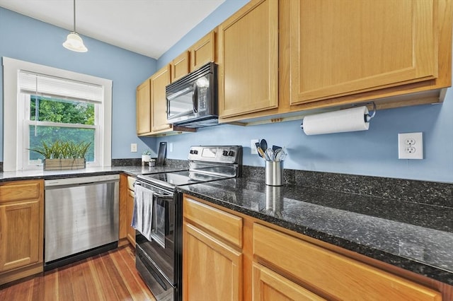 23 Starbird St, Lowell, MA 01854 - kitchen featuring black appliances, dark wood-type flooring, dark stone counters, and pendant lighting