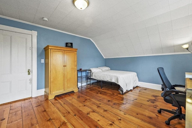 23 Starbird St, Lowell, MA 01854 - bedroom featuring wood-type flooring, crown molding, a desk, and lofted ceiling
