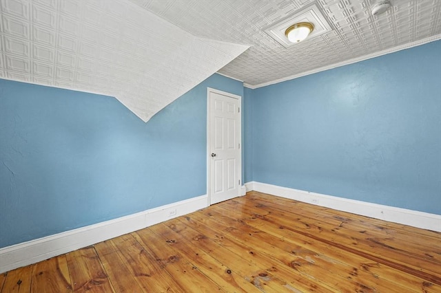23 Starbird St, Lowell, MA 01854 - bonus room featuring wood-type flooring and an ornate ceiling