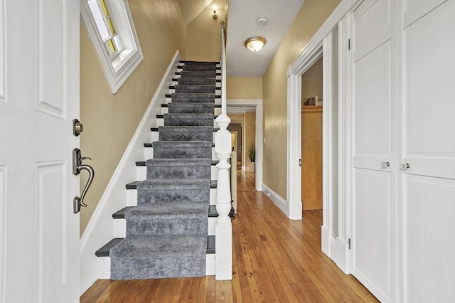 23 Starbird St, Lowell, MA 01854 - stairs with hardwood / wood-style flooring and baseboards
