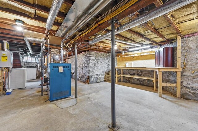 23 Starbird St, Lowell, MA 01854 - unfinished basement with washing machine and dryer, a heating unit, and water heater