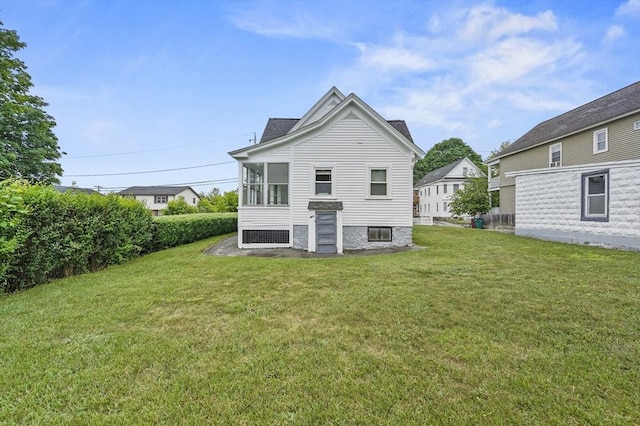 23 Starbird St, Lowell, MA 01854 - rear view of property featuring a yard