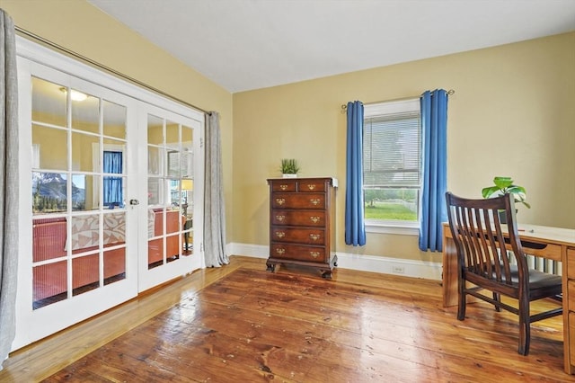 23 Starbird St, Lowell, MA 01854 - sitting room featuring french doors and hardwood / wood-style floors