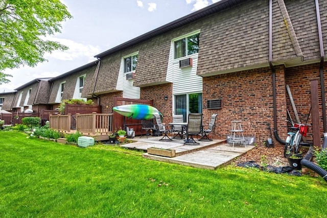 14 Hillcrest Park Unit 14, South Hadley, MA 01075 - rear view of house featuring brick siding, a wooden deck, and a yard