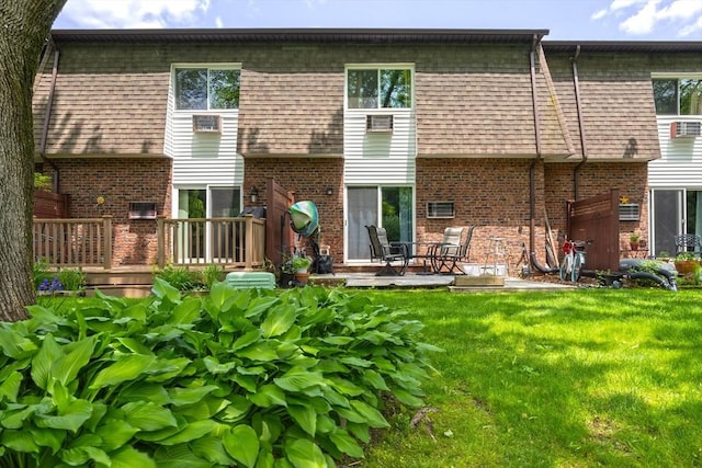 14 Hillcrest Park Unit 14, South Hadley, MA 01075 - rear view of property with brick siding, a lawn, a wooden deck, and mansard roof