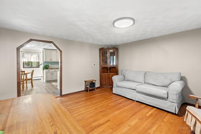 91 Bartholomew St, Peabody, MA 01960 - living room featuring arched walkways and light wood-style floors