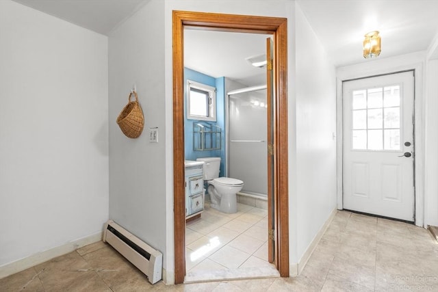 91 Bartholomew St, Peabody, MA 01960 - full bath with a baseboard heating unit, tile patterned floors, vanity, and a stall shower