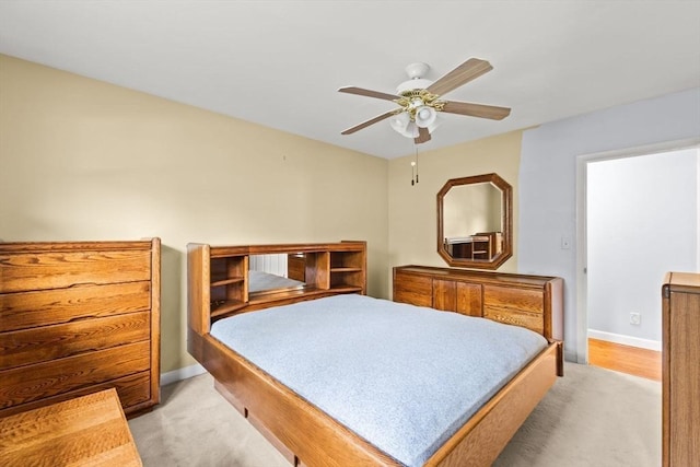 bedroom with baseboards and a ceiling fan