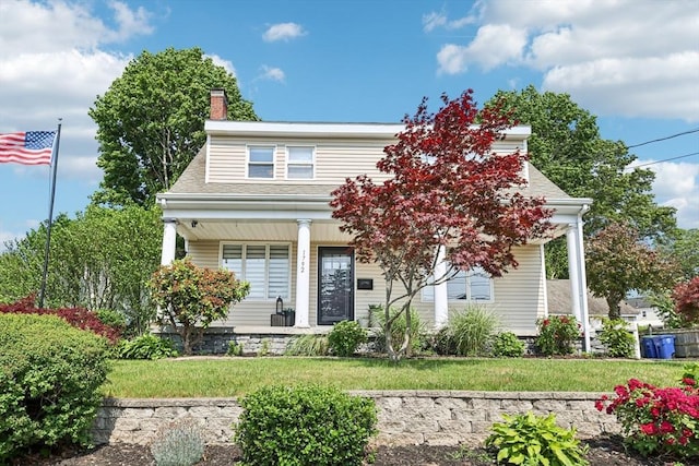 1792 Washington St, Braintree, MA 02184 - view of front of home featuring covered porch, a front yard, and a chimney