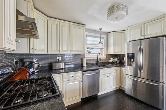 1792 Washington St, Braintree, MA 02184 - kitchen featuring stainless steel appliances, extractor fan, cream cabinets, and backsplash