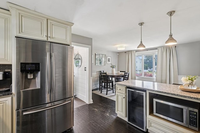 1792 Washington St, Braintree, MA 02184 - kitchen featuring stainless steel appliances, cream cabinetry, wine cooler, dark wood-style floors, and light stone counters