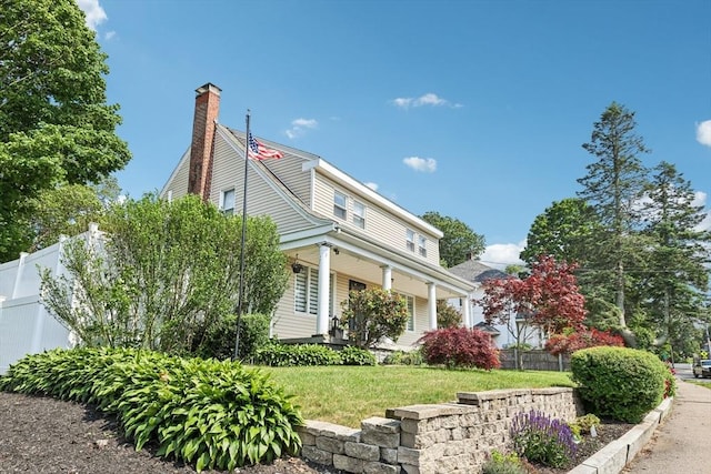 1792 Washington St, Braintree, MA 02184 - view of side of home featuring covered porch and a chimney