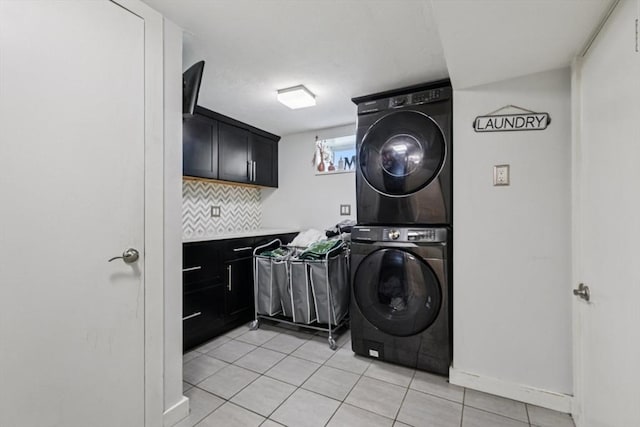 1792 Washington St, Braintree, MA 02184 - laundry area with stacked washer and clothes dryer and light tile patterned flooring