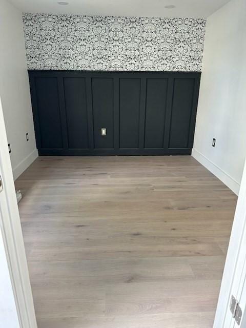 1792 Washington St, Braintree, MA 02184 - spare room with baseboards and light wood-style flooring