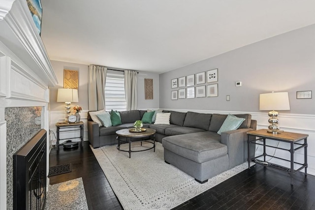 1792 Washington St, Braintree, MA 02184 - living area featuring dark wood finished floors and wainscoting