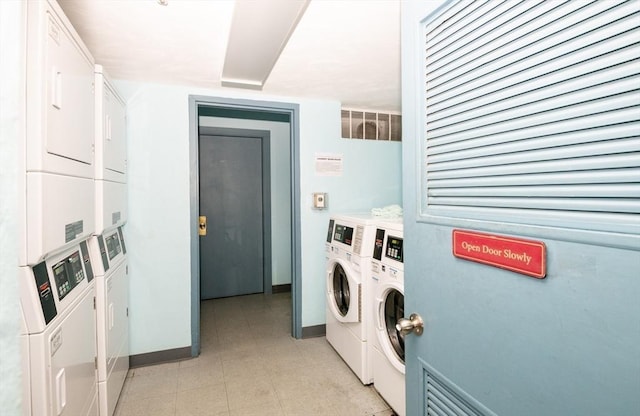 common laundry area with baseboards, independent washer and dryer, and stacked washing maching and dryer